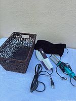 Group shot showing basket, steamer, curling iron, pouch
