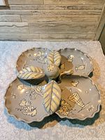 Top view showing hand-painted design, four compartments, leaf handles