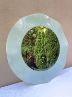 Front view showing frosted seafoam glass border and reflective center
