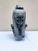 Front view of metal Queen Nefertiti bust showing overall form and surface chips