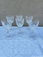 Front view of six crystal goblets on table