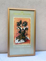 Front view of framed poster showing artwork and text