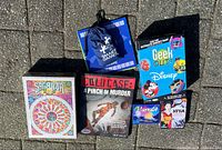 All six games laid out on pavement