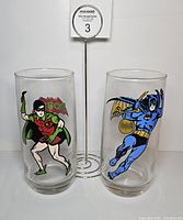 Front view of both tumblers showing Batman and Robin graphics