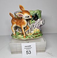 front view showing fawn figure and planter opening