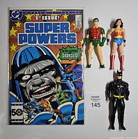 Comic book and three action figures overview