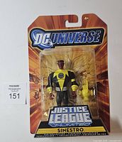 Front of sealed DC Universe Justice League Unlimited Sinestro figure with accessory
