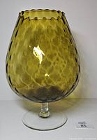 Front view of Empoli avocado green brandy snifter vase