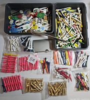 Overall view showing both trays of tees, divot tools, markers, packaged tees, card holder and letter opener