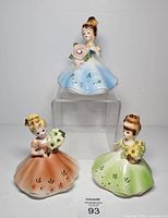 Front view of all three Birthday Month Girls figurines