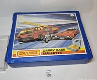 Front view of closed blue Matchbox carry case displaying graphic lid and model designation CC-48