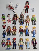Full view of all 20 Playmobil figures arranged in rows