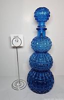 Full front view showing decanter and stopper