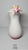 Front view of vase showing Pink Panther figure and flared shape