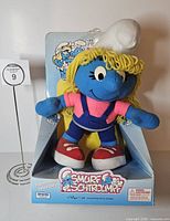 Front view of boxed Smurfette plush showing branding and character details
