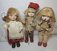 Front view of three dolls
