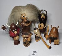 Front view of all six Scandinavian teak figurines