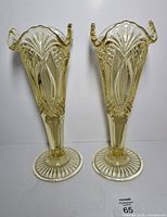 Front view of both amber Indiana Zipper vases standing upright