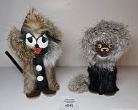 Both wooden fur animal figurines front view