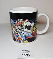 Front view showing Voltron artwork on mug