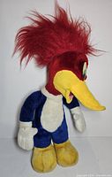 Full front view of Woody Woodpecker plush showing overall condition and colors