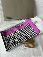 Pocket square in gift box showing pattern, border and tags