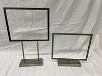 Front view showing both brushed metal frames, one vertical one horizontal