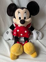 Front view of Minnie Mouse plush showing entire toy and clothing details