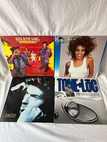 Group shot of the four vinyl LP jackets