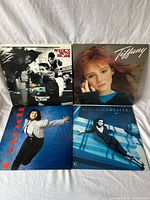 Front view of all four LP jackets side by side