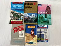 All six travel books arranged front covers visible