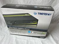 Front of sealed TRENDnet TEG-S80g switch box showing branding and 8-port gigabit specification