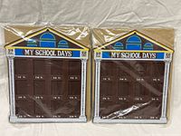 Both sealed schoolhouse picture frames side by side