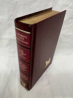 Oblique view of book showing cover texture and thickness