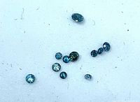 Group of small blue diamonds on white background