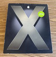 Front of Mac OS X Tiger retail box with metallic X graphic and 10.4.3 sticker