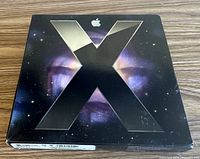 Front of retail box showing metallic X design
