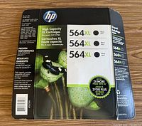 Front of HP 564XL three-pack backing card showing product details