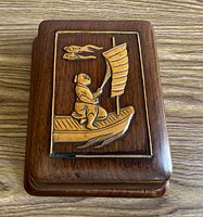 Top view showing carved inlay scene on lid