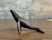 Side profile of bronze whale sculpture
