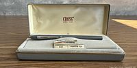 Closed view of Cross fountain pen in box with plaques visible