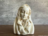 Front view of ivory crackle-glazed ceramic Madonna bust