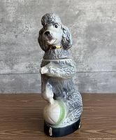 Full view front and left side of ceramic poodle decanter