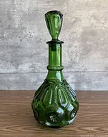 Full view of green Moon and Stars decanter with stopper