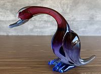 Left profile of Murano sommerso duck showing color gradient and form