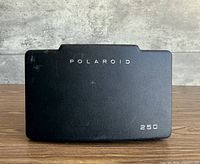 Front cover with Polaroid and 250 model marking visible