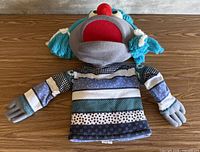 Full view of puppet laid flat showing overall design and size