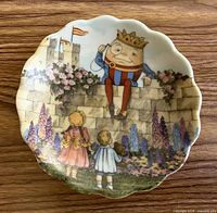 Front view of miniature Humpty Dumpty plate showing illustration and scalloped rim