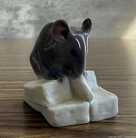 Front left view of porcelain mouse on sugar cubes