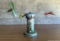 Front view of tin tower and three planes extended